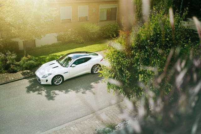 Car parked in the shade when everything else is in direct sunlight.