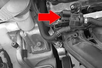 purge valve and charcoal canister location with red arrow pointing to them in the engine bay