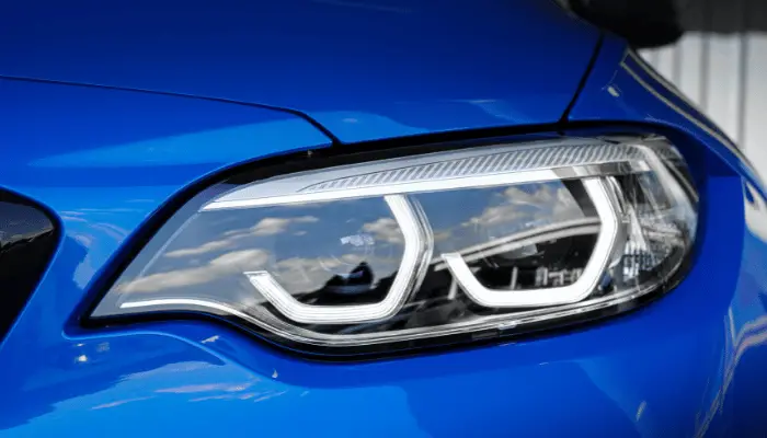 Blue BMW with Clear Headlights as Featured Image "How To Clean Yellow Headlights at Home"