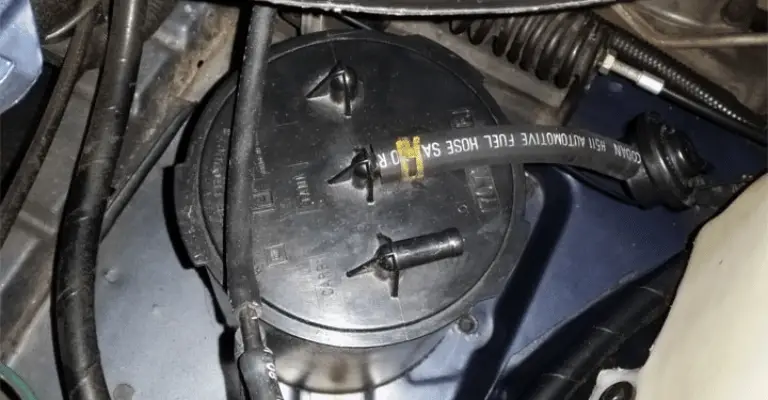 charcoal canister in the engine bay of a car used to describe where the purge valve is typically located