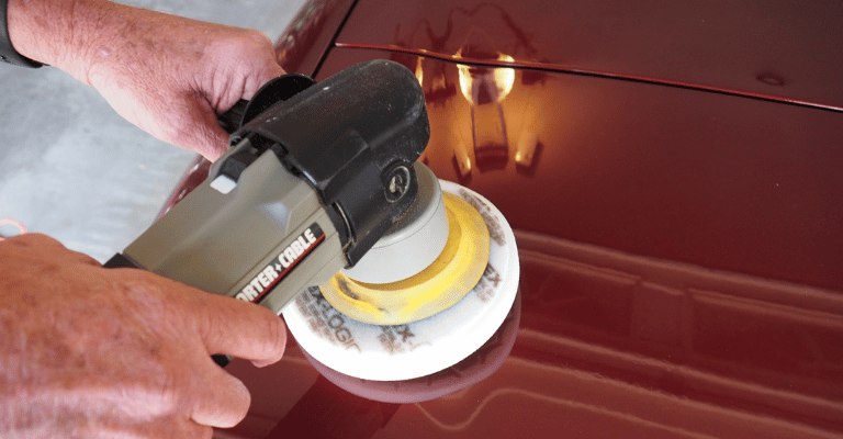showing how waxing with a car buffer will prevent water spots