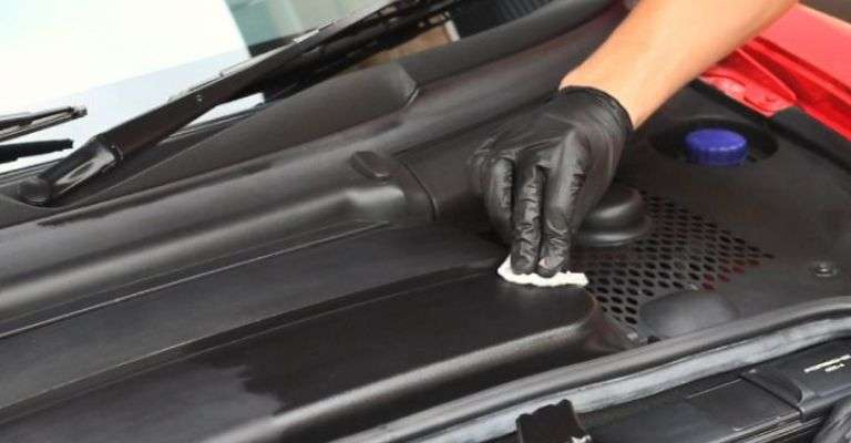 expert detailer showing the benefits of protecting and maintaining your plastic trim after the restoration process